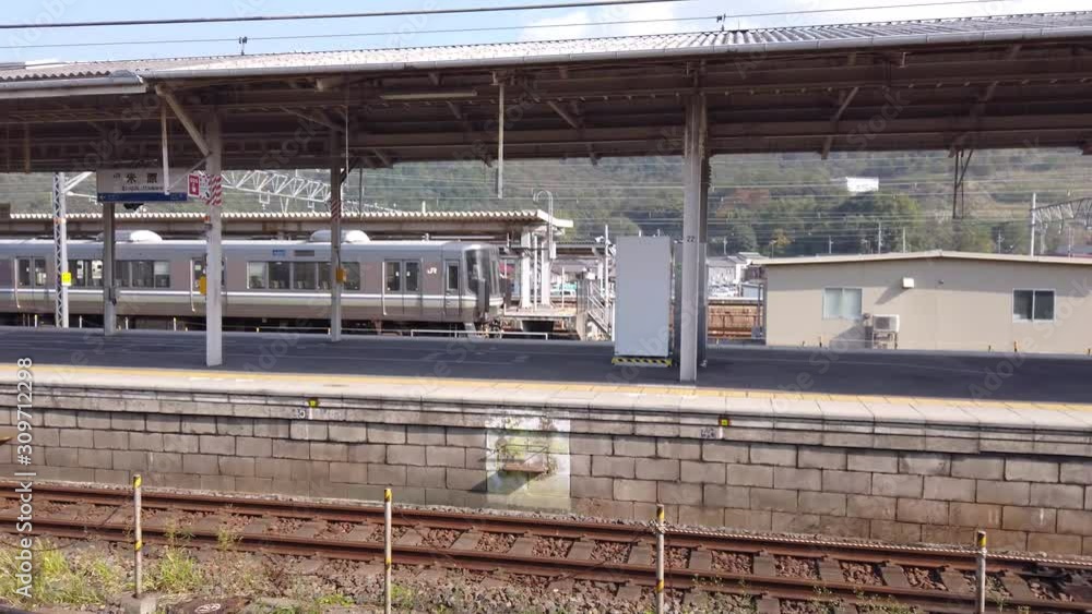 Maibara local train station, Pan left shot of JR West commuter train Maibara local train station, Pan left shot of JR West commuter train