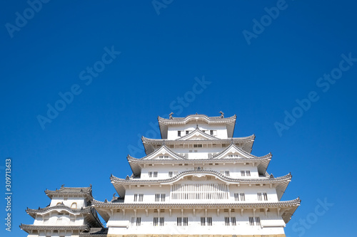 The Himeji castle with angle of elevation and blue sky, an UNESCO World Heritage site, is the most visited castle in Himeji, Japan.