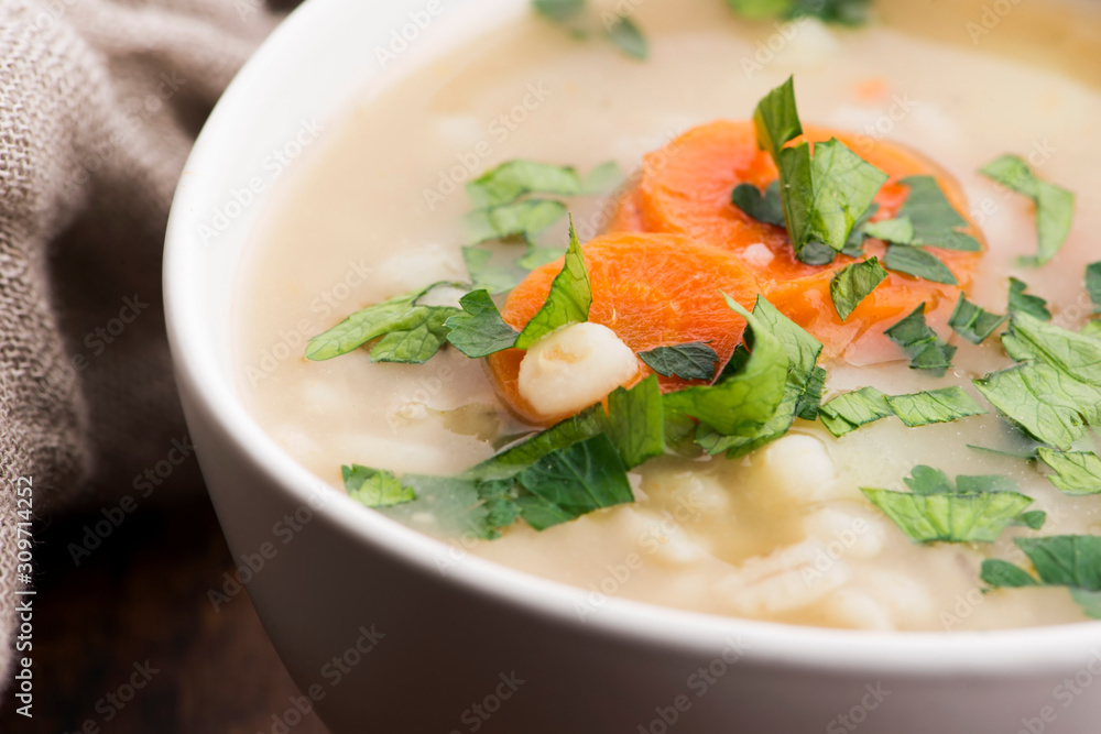 Barley soup, pearl barley in white bowl