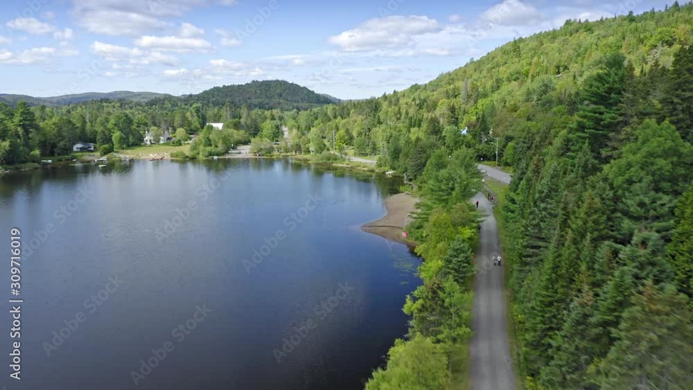 Aerial: Forest & calm tranquil Lac Raymond in the Laurentian Mountains near Montreal, Quebec, Canada Aerial: Forest & calm tranquil Lac Raymond in the Laurentian Mountains near Montreal, Quebec, Canada