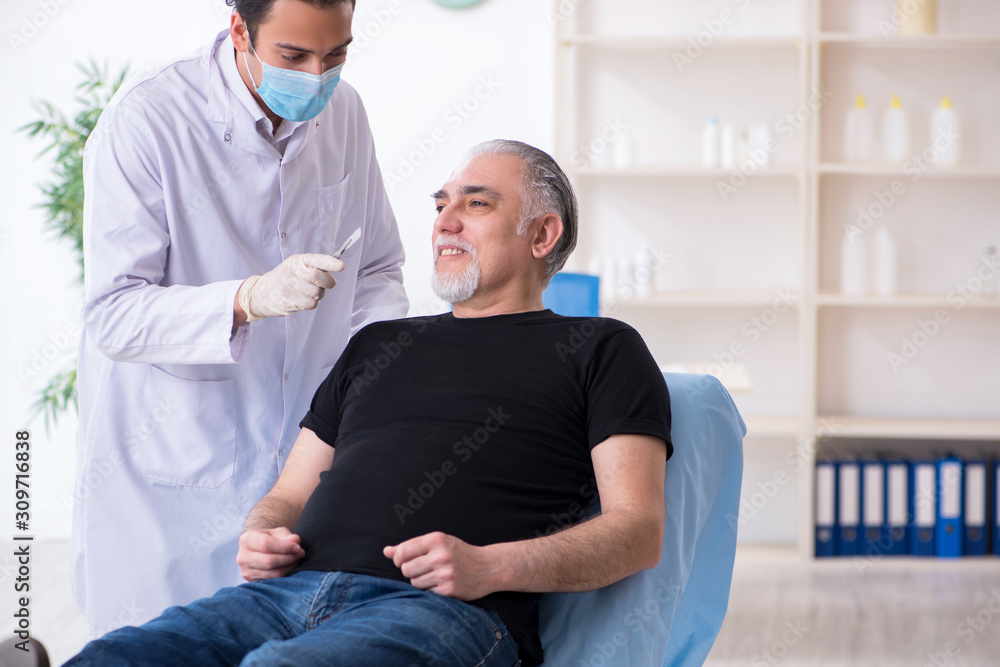 Old man visiting young doctor for plastic surgery Old man visiting young doctor for plastic surgery