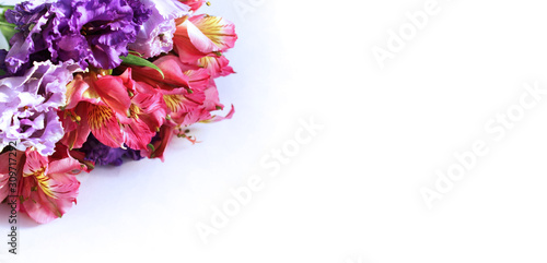 Festive floral arrangement in bright colors. Pink and crimson flowers on a white background. Roses, chrysanthemums and ectromelia in an elegant bouquet. Background for greetings, invitations, cards fo photo