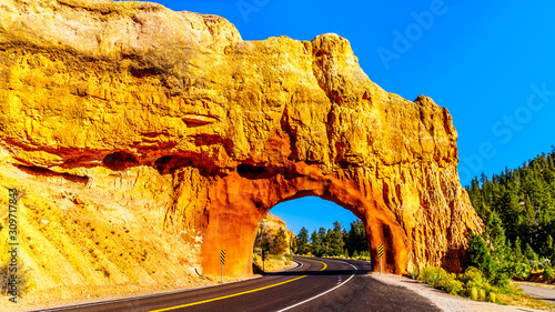 Tunnel carved in the Red Sandstone mountains of Red Canyon for Highway 12 between Highway 89 and Bryce Canyon National Park, Utah, United States photo