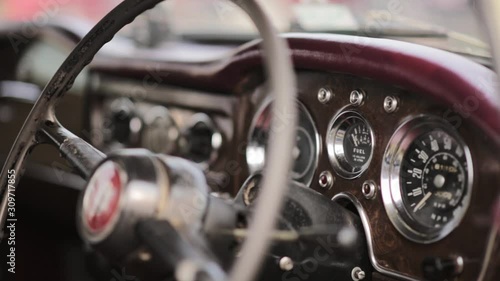 Focus Shift Shot Of A Steering Wheel In A Classic Car.