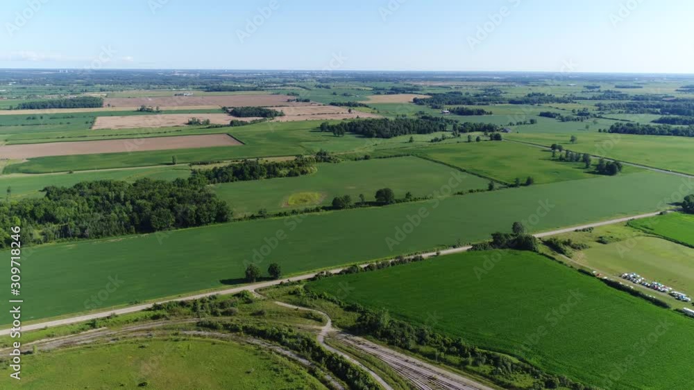 Panorama Of Vast Farmland Aerial With Blue Sky And Some Clouds Panorama Of Vast Farmland Aerial With Blue Sky And Some Clouds