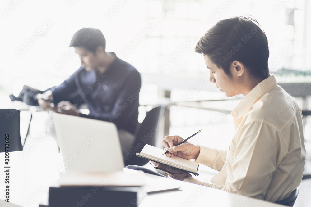 Portrait of casual young entrepreneur businessman working in modern work station. Portrait of casual young entrepreneur businessman working in modern work station.