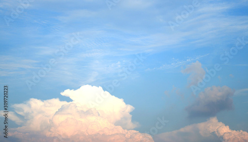 bright white fluffy clouds in the blue sky