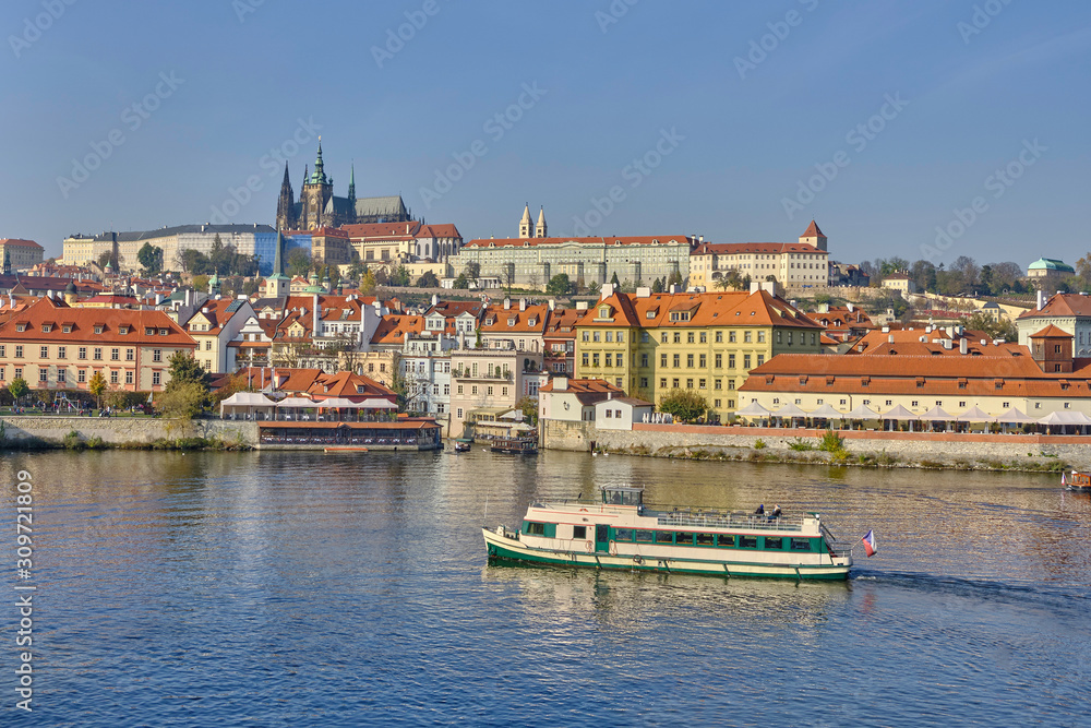 Scenic panorama with Prague Castle (Prazsky hrad) and Vlatva river in capital of Czech Republic Prague. Beautiful summer sunny cityscape of the biggest city of Czechia
