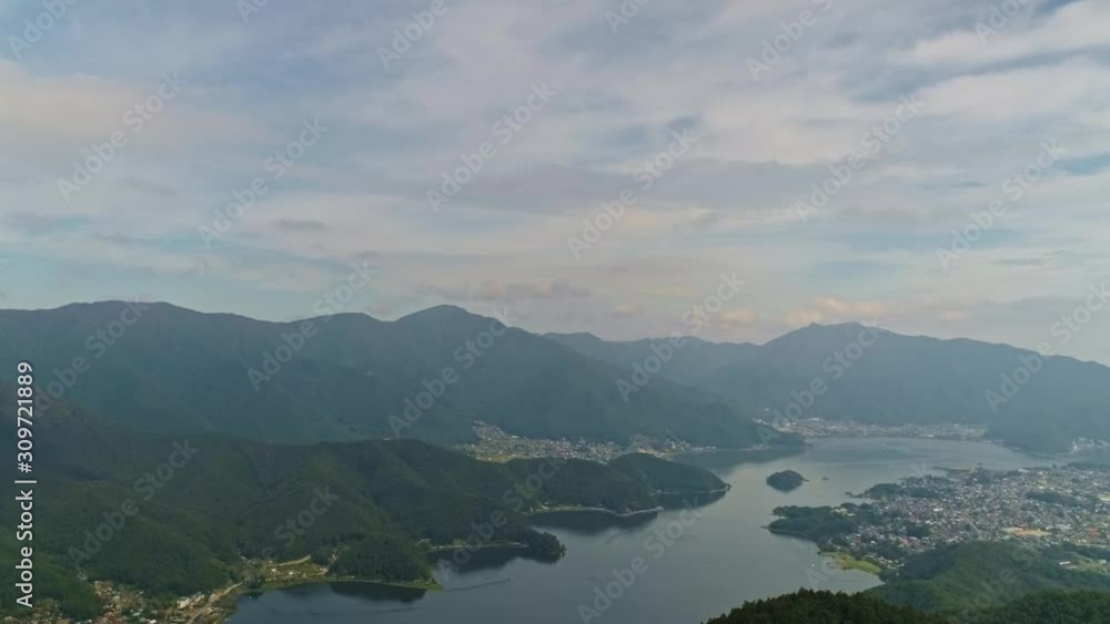 Drone fly above flat water surface of Kawaguchi Lake over Fujikawaguchiko town Drone fly above flat water surface of Kawaguchi Lake over Fujikawaguchiko town