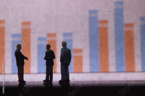 Simple Illustration Photo,Gruap of Man and Woman doing a Business meeting with graphic Chart as a background