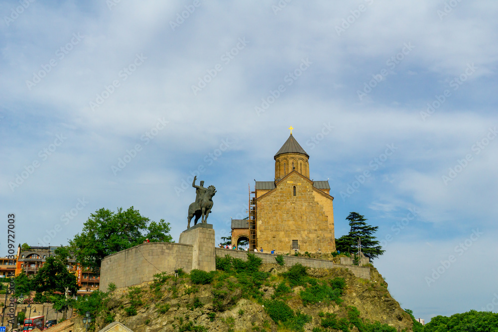 Metekhi St. Virgin Church and King Gorgasali Statue over Kura river, Tbilisi, Georgia