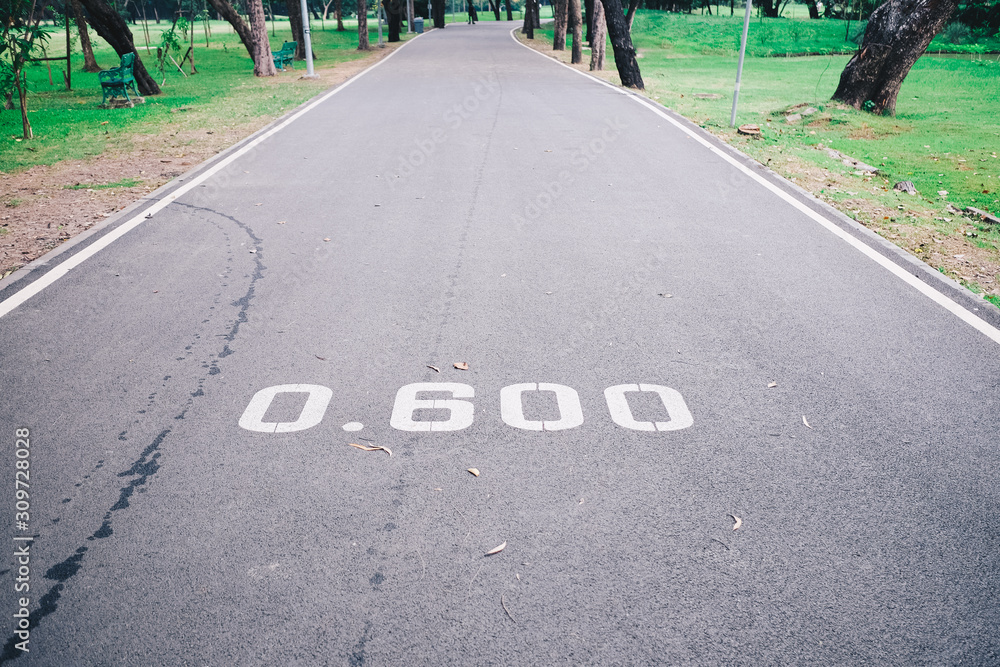 Obraz premium The number on the road, distance 0.60 m, is a number indicating the location.