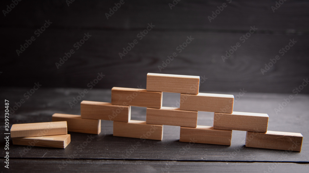 form for network marketing text. Wooden cubes laid out in the form of a pyramid form for network marketing text. Wooden cubes laid out in the form of a pyramid