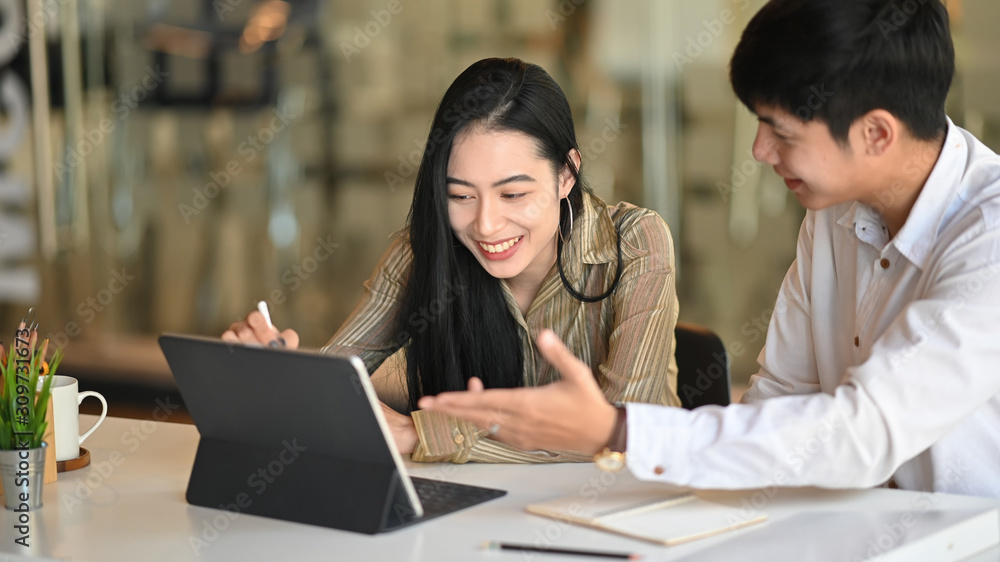 Asian business people they meeting with digital tablet on modern office. Asian business people they meeting with digital tablet on modern office.