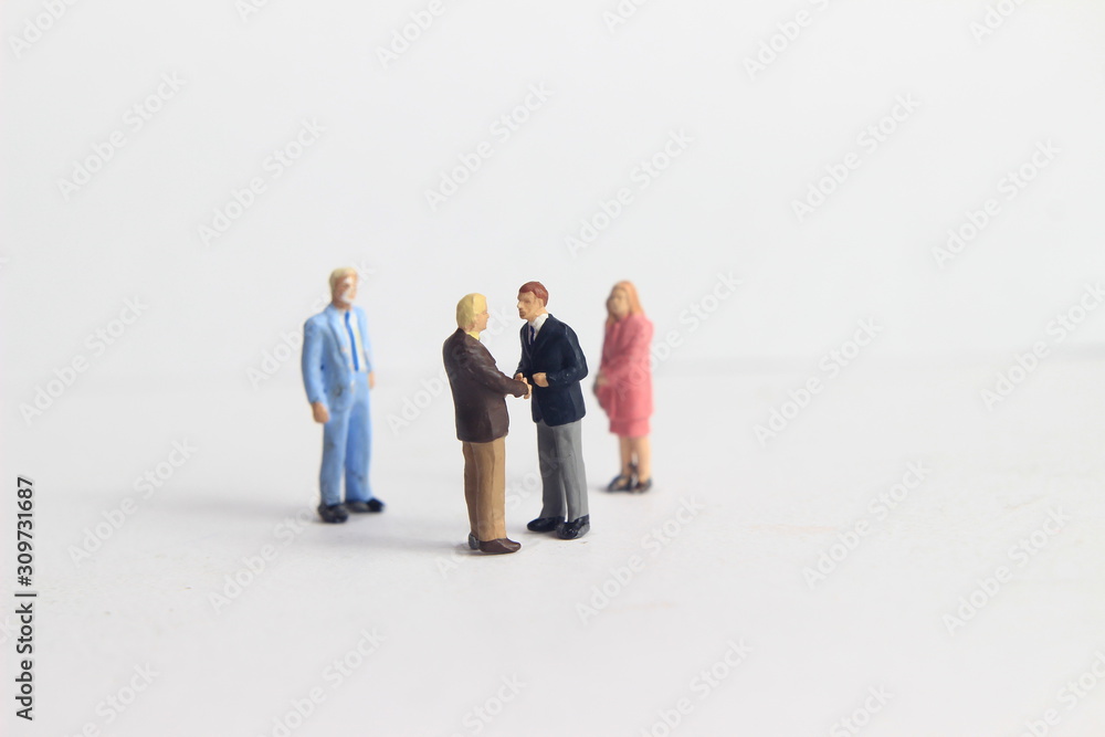 Gray Backgrond, Simple Illustration Photo for Mini Figure Two Man Toy Handshaking for Business Agreement Beyond their partner Gray Backgrond, Simple Illustration Photo for Mini Figure Two Man Toy Handshaking for Business Agreement Beyond their partner