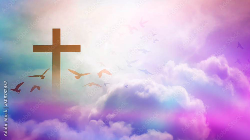 Christian cross appeared bright in the sky with soft fluffy clouds, white, beautiful colors. With the light shining as hope, love and freedom in the sky background