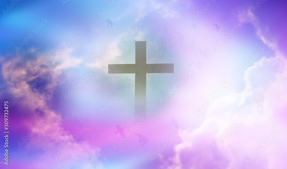Christian cross appeared bright in the sky with soft fluffy clouds, white, beautiful colors. With the light shining as hope, love and freedom in the sky background Christian cross appeared bright in the sky with soft fluffy clouds, white, beautiful colors. With the light shining as hope, love and freedom in the sky background