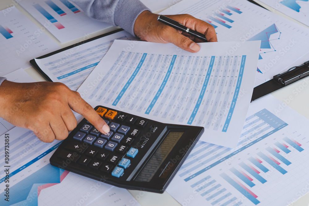 businessman working calculate data document graph chart report marketing research development planning management strategy analysis financial accounting. Business office concept. businessman working calculate data document graph chart report marketing research development planning management strategy analysis financial accounting. Business office concept.