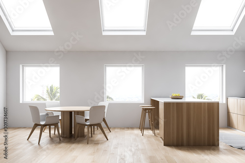 Attic white kitchen with bar and table, side view © ImageFlow