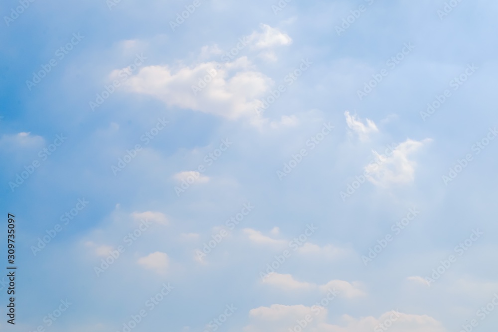Beautiful fluffy white clouds with blue sky and Sunlight, Nature background.