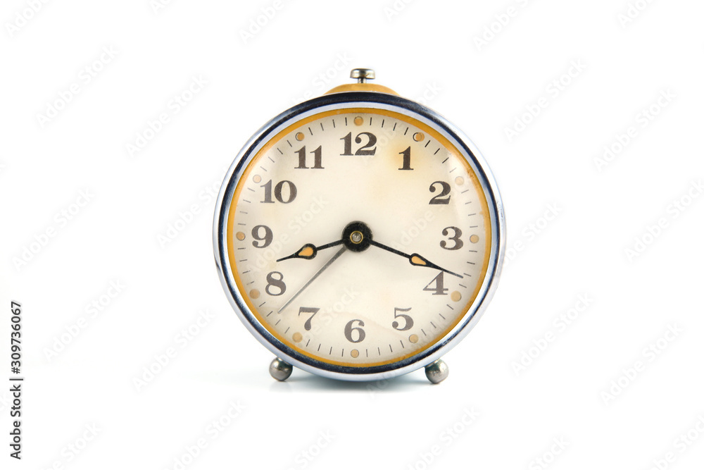 Old mechanical table clock isolated on white background.. Old mechanical table clock isolated on white background..