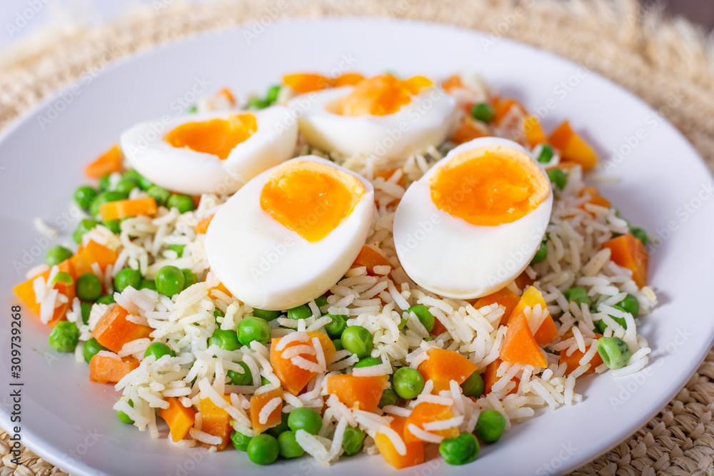 Basmati rice with eggs, carrots and green peas. Basmati rice with eggs, carrots and green peas.