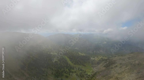 Wallpaper Mural Aerial view of mountain landscape from cloud. Drone flying through the clouds in the mountains Torontodigital.ca