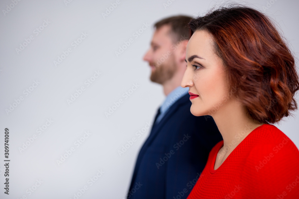 relationship and love concept - side view of upset couple over white background relationship and love concept - side view of upset couple over white background