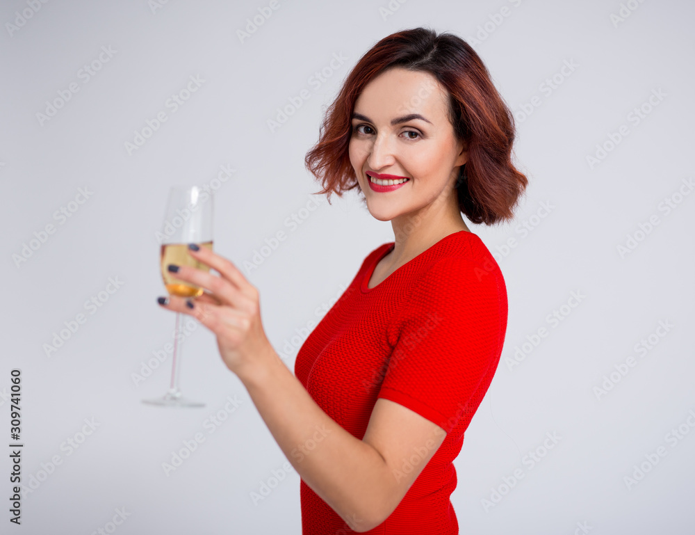 new year concept - portrait of young woman posing with glass of champagne over white new year concept - portrait of young woman posing with glass of champagne over white