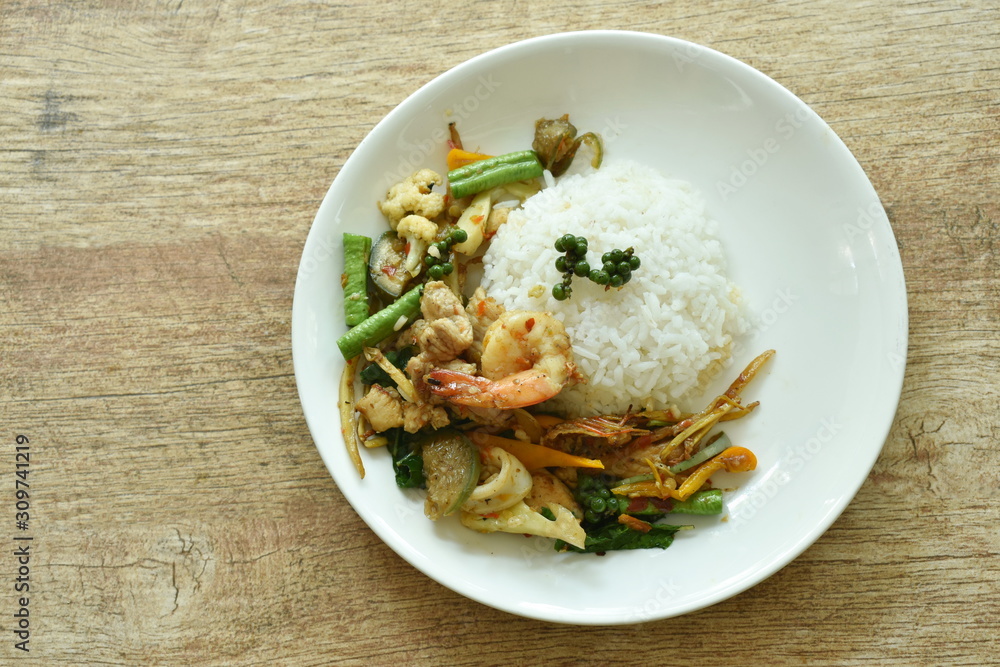 spicy stir fried seafood and meat with chili on rice spicy stir fried seafood and meat with chili on rice