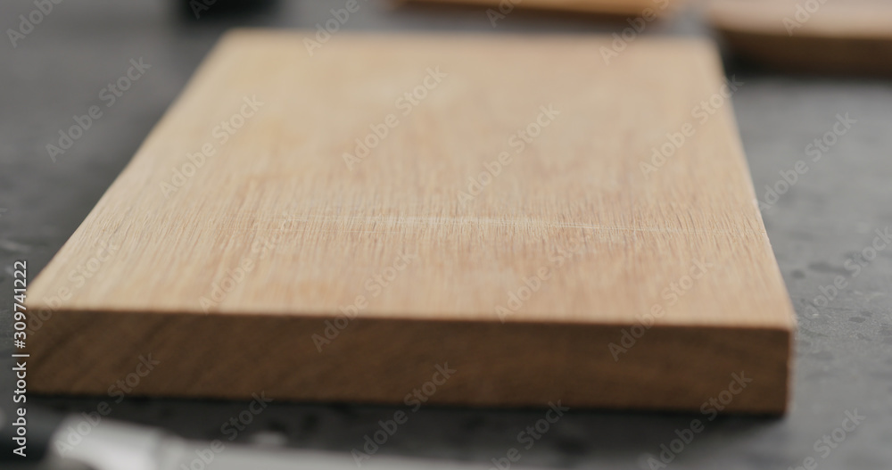 empty oak cutting board on terrazzo countertop empty oak cutting board on terrazzo countertop