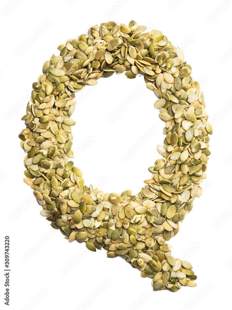 Obraz premium Letter Q of the English alphabet from pumpkin seeds on a white isolated background. Food pattern made from seeds. Bright alphabet for shops.