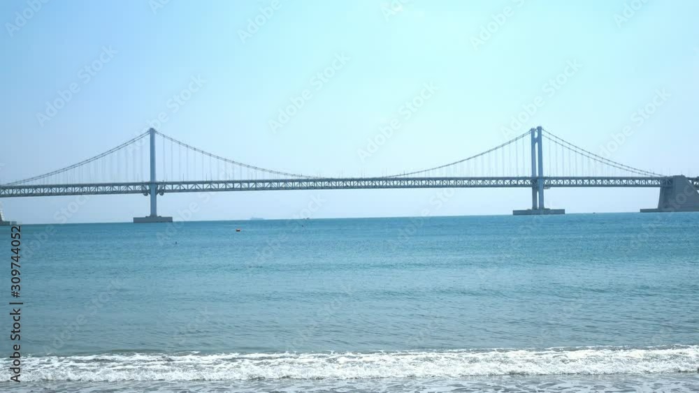 View of Gwangan Bridge from Gwangalli Beach in Busan, South Korea. View of Gwangan Bridge from Gwangalli Beach in Busan, South Korea.