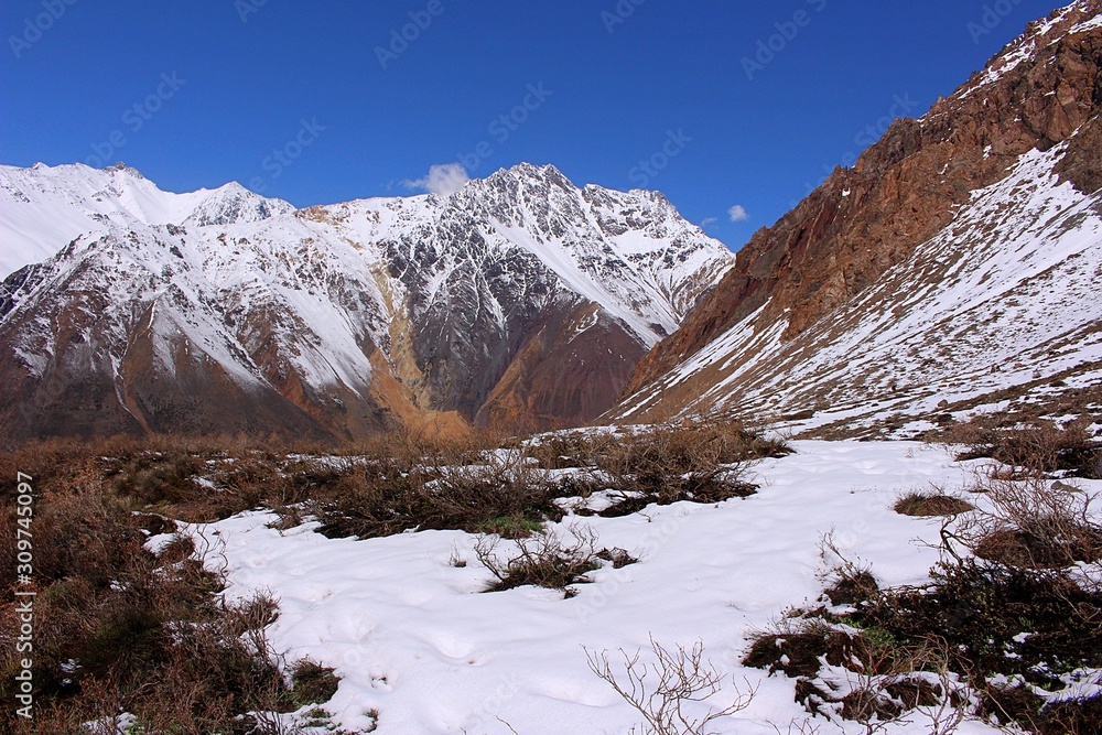 Valley among snowy mountains in Cajón del Maipo, central Andes of Chile.