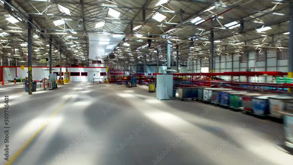 Aerial photography flying INSIDE of a large sorting facility, next to conveyor belts. Aerial photography flying INSIDE of a large sorting facility, next to conveyor belts.