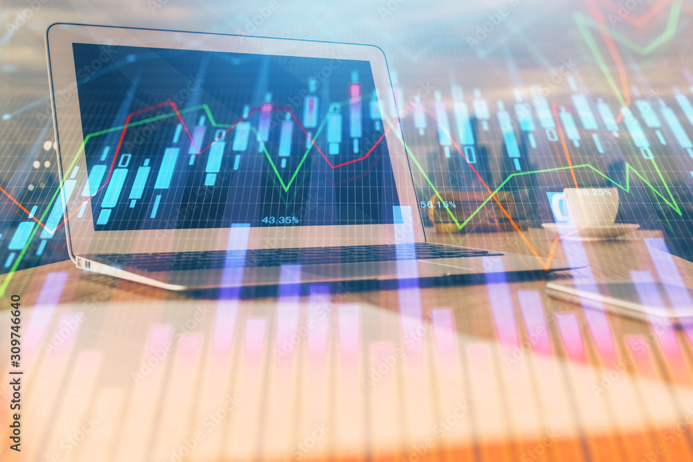 Stock market graph on background with desk and personal computer. Multi exposure. Concept of financial analysis.