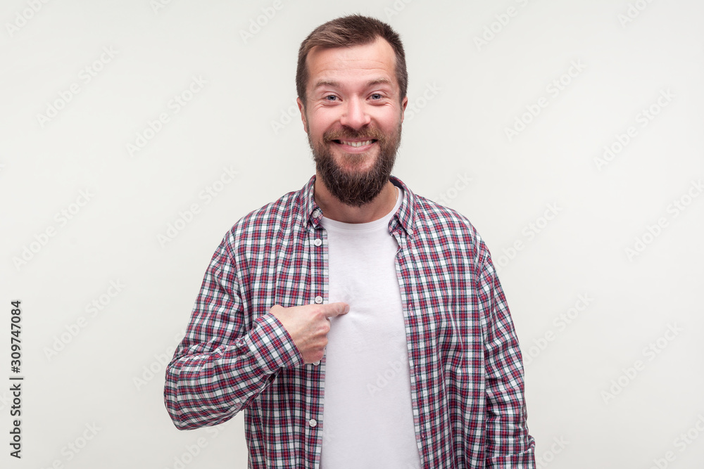 This is me! Portrait of pleased happy man with beard in casual plaid shirt smiling and pointing at himself, boasting achievements, saying I did it. indoor studio shot isolated on white background This is me! Portrait of pleased happy man with beard in casual plaid shirt smiling and pointing at himself, boasting achievements, saying I did it. indoor studio shot isolated on white background