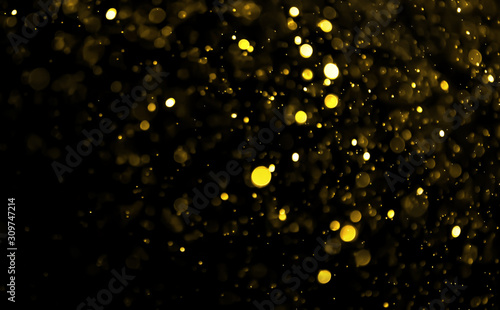 abstract golden bokeh light on black background