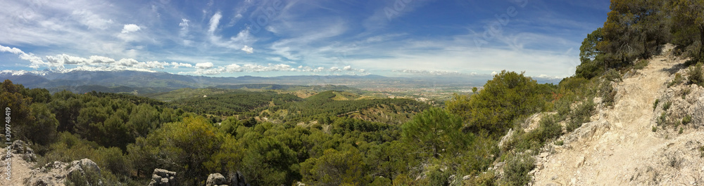 The Sierra de Huétor is a mountain range of the Baetic System in Granada Province, Andalusia, Spain. Mirador cruz de viznar, landscape and nature viewpoint on a hiking trail in Spain