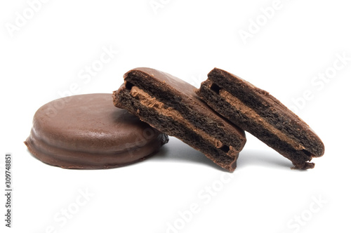 Chocolate sandwich cookies filled and coated with chocolate cream isolated on white background.