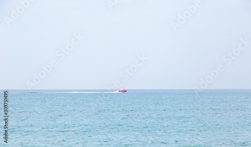 Little red boat on the sea