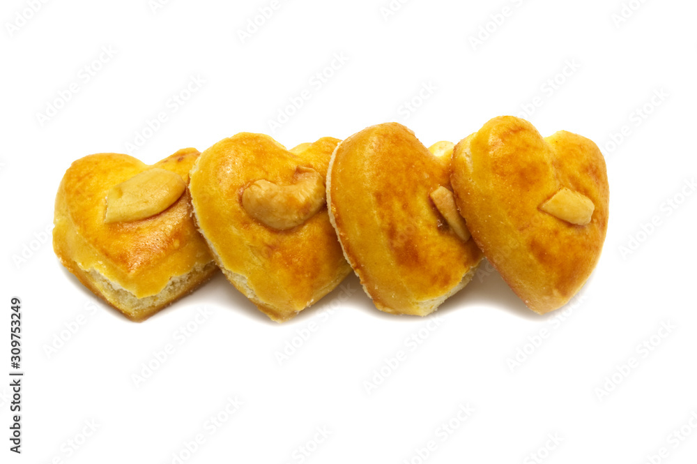 Cashew nut or Singapore cookies of heart shape isolated on white background for valentine's day or other celebration element concept design. Cashew nut or Singapore cookies of heart shape isolated on white background for valentine's day or other celebration element concept design.