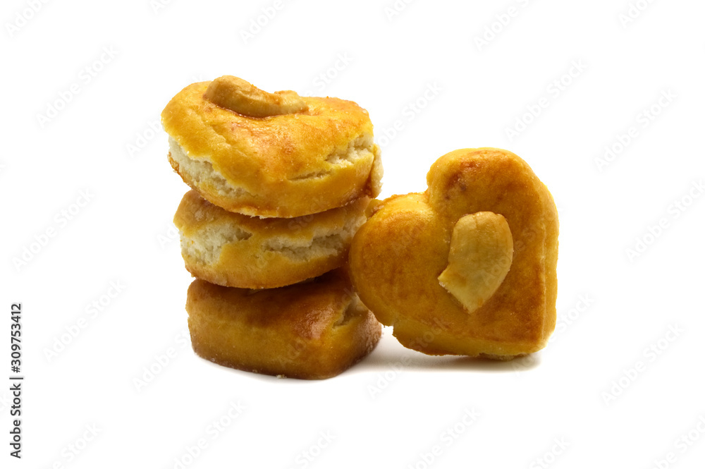 Cashew nut or Singapore cookies of heart shape isolated on white background for valentine's day or other celebration element concept design. Cashew nut or Singapore cookies of heart shape isolated on white background for valentine's day or other celebration element concept design.