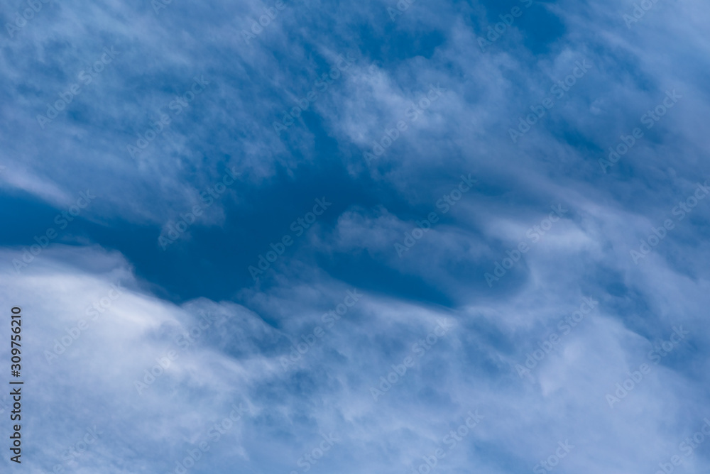 Abstract background with white clouds on blue sky