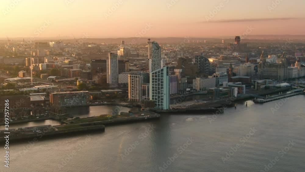 liverpool aerial shot drone flying sideways along waterfront city centre sunny day at sunrise liverpool aerial shot drone flying sideways along waterfront city centre sunny day at sunrise