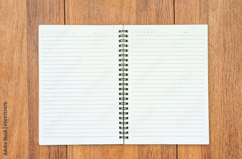 Top view image of open notebook with blank pages on wooden table Top view image of open notebook with blank pages on wooden table