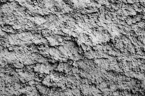 Cement plaster fur coat. Street plaster on the wall. Texture, large bumps. Gray empty background. Decoration of facades of buildings.