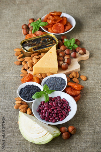 Various products rich in calcium on a brown background 