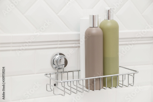 Toiletries bottles on suction cups compact bath shelf, fixing on tiled wall without drilling
