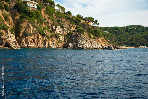 Barcelona, Spain - 18.08.2019: Rocky spanish coast and blue sea in spain